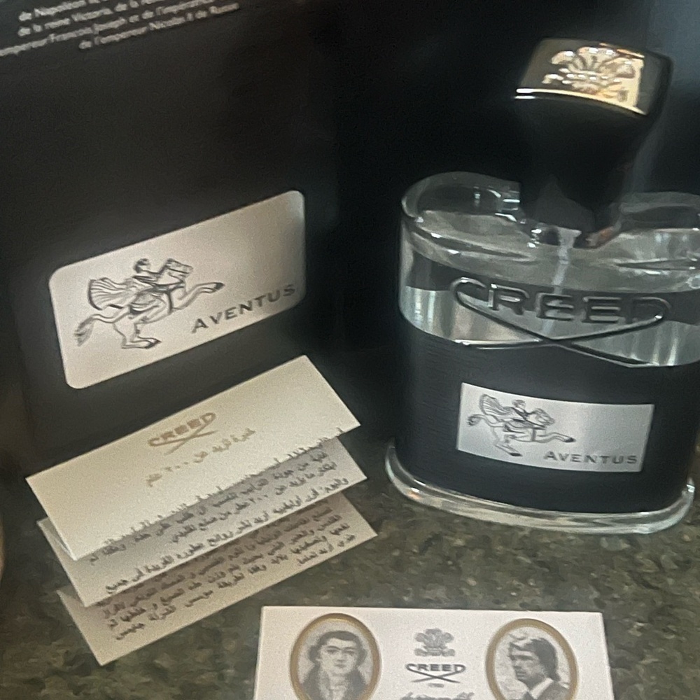 Creed Aventus Bottle with Black and Silver Accents